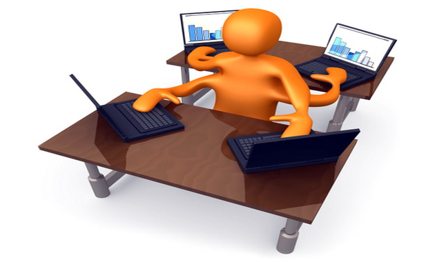 Orange Employee Multitasking While Operating Four Laptop Compute